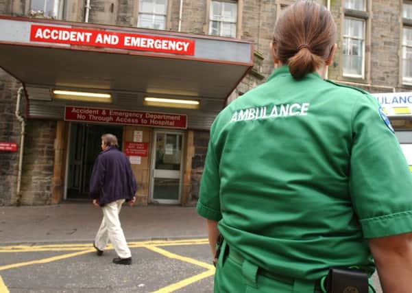 Paramedics standing outside an accident and emergency department in Edinburgh. Picture: TSPL