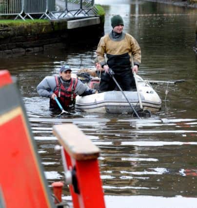 Fishery scientists using electro-fishing to clear the Union Canal in Linlithgow today. Picture: Lisa Ferguson
