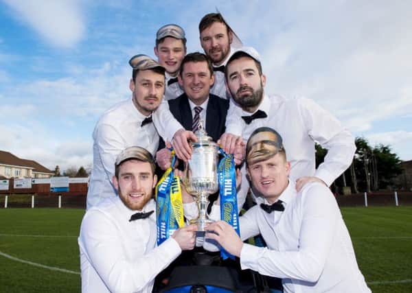 Bonnyrigg Rose players get their hands on the Scottish Cup during their 'James Bond' photoshoot. Picture: SNS.