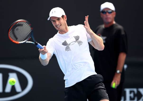Andy Murray practises under the watchful eye of coach Ivan Lendl. Picture: Cameron Spencer/Getty Images