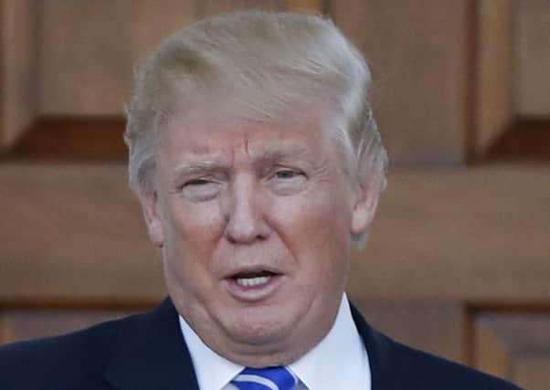 Plans by Donald Trump's firm to expand a golf course in Scotland have sparked concern. Picture: AP Photo/Carolyn Kaster, File