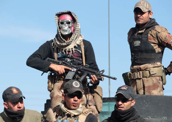 Iraqi counter-terrorism service members patrol the town of Bartalla, east of Mosul. Picture: AFP/Getty Images