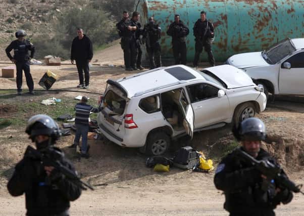 The vehicle in which an Arab Israeli man was shot dead after allegedly driving at and killing a police officer, sparking protests. Picture: AFP/Getty Images