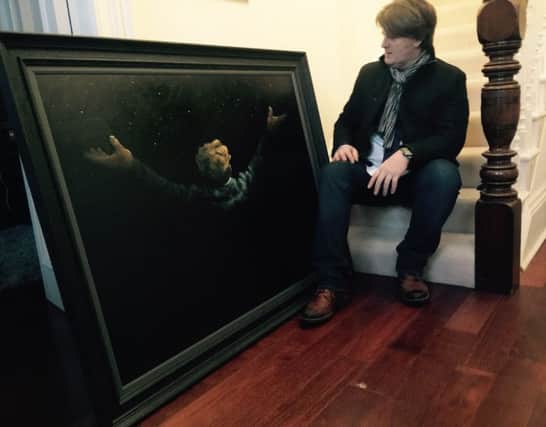 Alexander Millar with the painting. Picture: Contributed