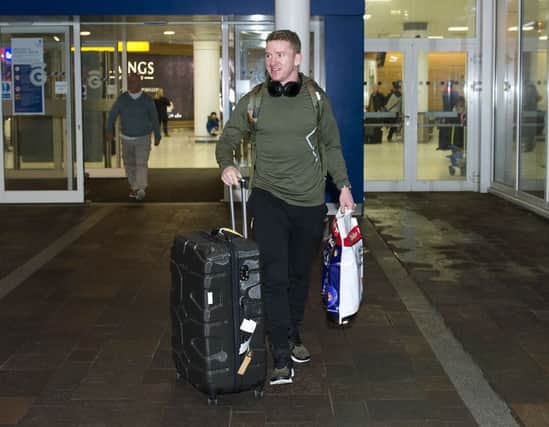 Jonny Hayes arrives back from Aberdeen's training camp in Dubai. Picture: SNS