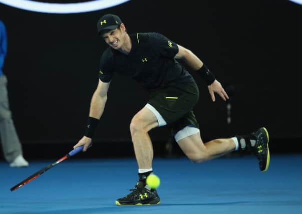 Sir Andy Murray shows his discomfort as he tries to run for the ball after injuring his ankle during his second round win over Andrey Rublev at the Australian Open. Picture: Clive Brunskill/Getty Images