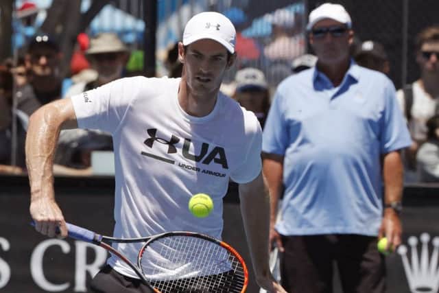 Andy Murray is watched by his coach Ivan Lendl during practice. Picture: Dita Alangkara/AP