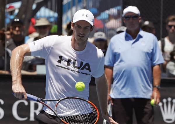 Andy Murray is watched by his coach Ivan Lendl during practice. Picture: Dita Alangkara/AP