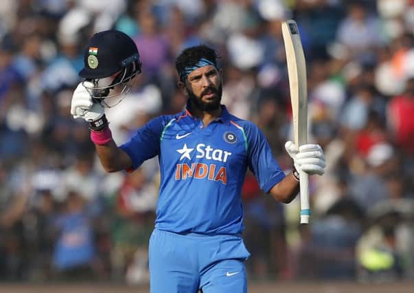 India's Yuvraj Singh celebrates scoring his 14th ODI century at the Barabati Stadium in Cuttack. Picture: Aijaz Rahi/AP