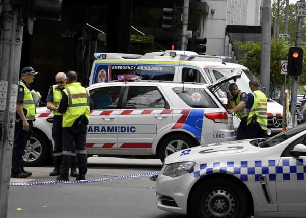 Emergency services on the scene after a car ploughed into pedestrians in Melbourne. Picture: AP/Andrew Brownbill
