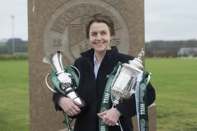 Hibs chief executive Leeann Dempster clutches the Scottish Cup and a commemorative cup presented to the club by sponsors William Hill. Picture: Craig Foy/SNS