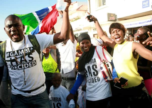 Supporters of Gambias president-elect Adama Barrow celebrate outside of the Gambian embassy in Dakar. Picture: Getty