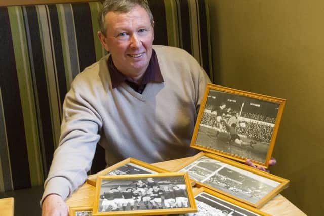 Former Hearts striker Willie Gibson with memorabilia from his illustrious career. Picture: Ian Rutherford