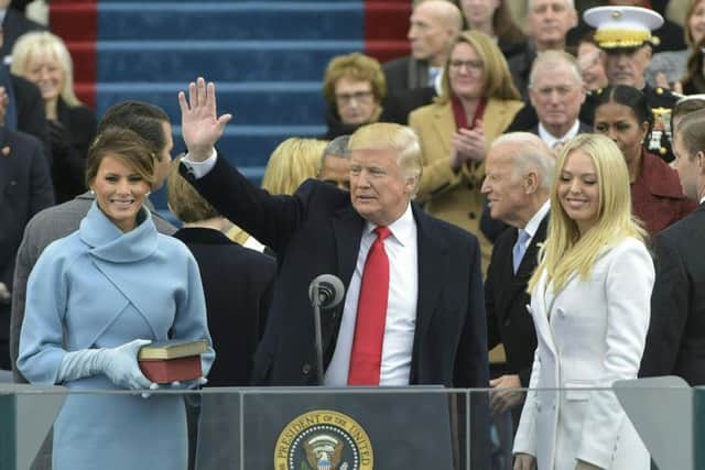 US President Donald Trump acknowledges his family and the crowd after taking the oath of allegiance during his swearing-in ceremony. Picture: Getty