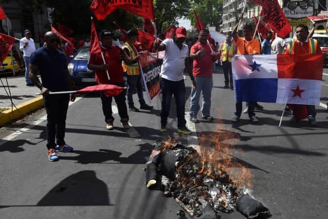 Panamanians protest the inauguration of new US President Donald Trump, burning an effigy of him, in Panama City. Picture: Getty