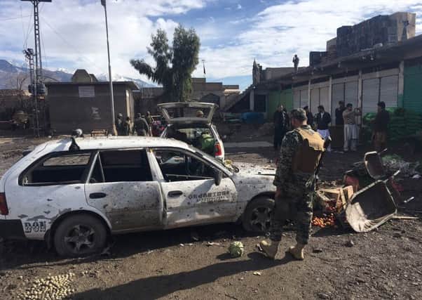 Security officials and residents at the scene of the explosion in Parachinar. Picture: AFP/Getty