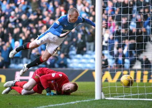 Kenny Miller soared through the air to plant a header past Craig Samson and spark a Rangers comeback. Photograph: Jane Barlow/PA