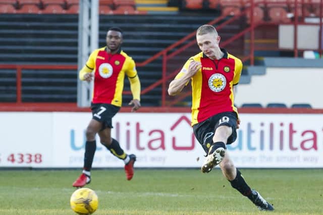 Chris Erskine fires home the third goal of the game