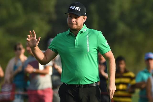 Leader Tyrrell Hatton of England acknowledges the crowd on the 18th green during the third round of the Abu Dhabi HSBC Championship. Picture: Ross Kinnaird/Getty Images