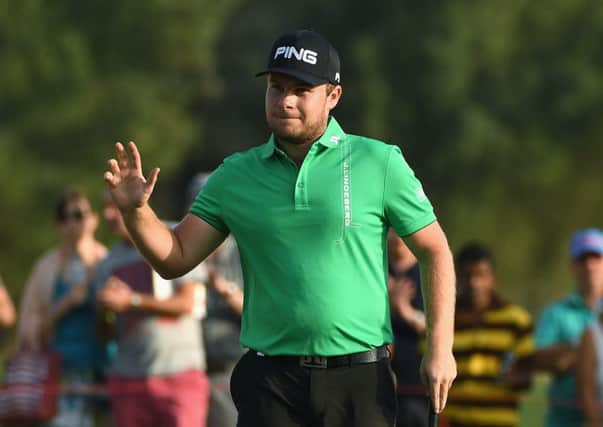 Leader Tyrrell Hatton of England acknowledges the crowd on the 18th green during the third round of the Abu Dhabi HSBC Championship. Picture: Ross Kinnaird/Getty Images