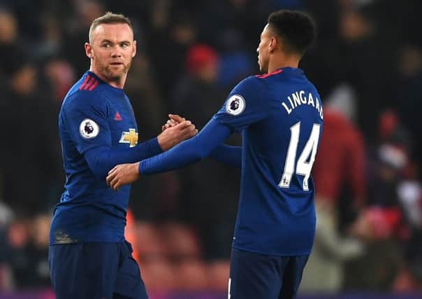 Wayne Rooney celebrates with Jesse Lingard. Pic: Gareth Copley/Getty Images