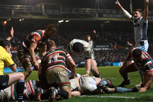 Glasgow's Henry Pyrgos, right, celebrates as Tim Swinson goes over for the Warriors' sixth try against Leicester Tigers. Picture: Stu Forster/Getty Images