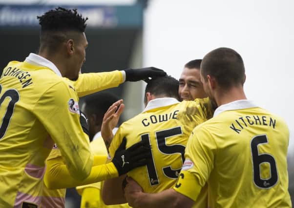 Jamie Walker celebrates with team-mates after putting Hearts ahead at Stark's Park. Picture: SNS