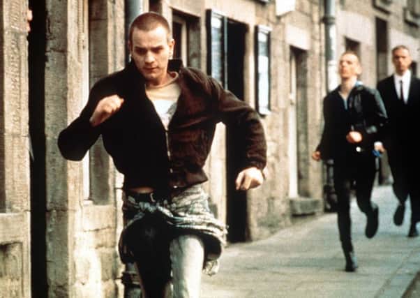 Ewan McGregor in Trainspotting being chased in street