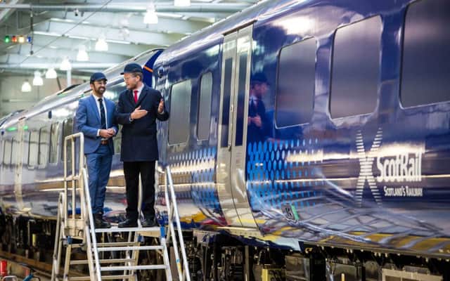 Transport minister Humza Yousaf and ScotRail Alliance managing director Phil Verster inspecting a new ScotRail Class 385 electric train last month. Picture: Ross Parker/SNS