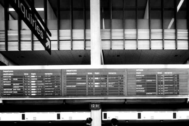 The flights departure board inside the terminal