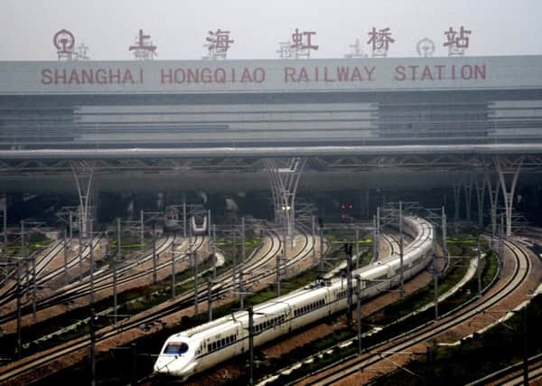 A train which can run at speeds up to 300 kilometres (185 miles) per hour goes on a trial run in Shanghai on May 11, 2011. Trial runs began on the highly anticipated high-speed rail line between Beijing and Shanghai, one month before the link is due to go into commercial service, state media reported.       CHINA OUT        AFP PHOTO (Photo credit should read STR/AFP/Getty Images)