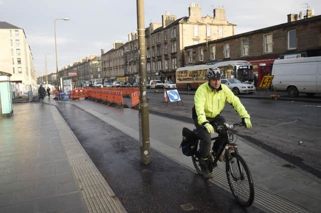 A new cycle lane recently opened on Leith Walk - but cyclists have complained about having to dodge a lamppost in the middle of it. Picture: Greg Macvean/JP Resell