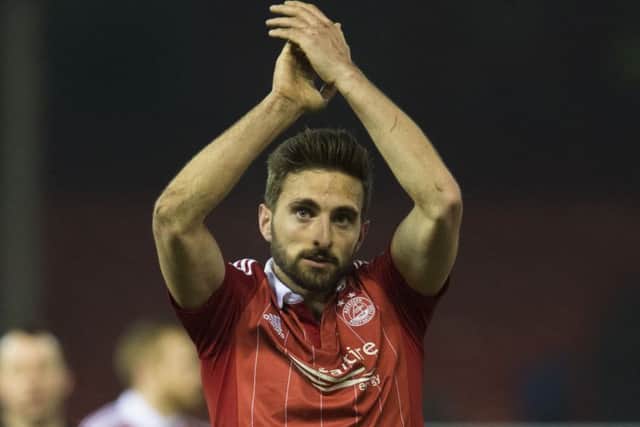 Graeme Shinnie has signed a contract extension until 2019. Picture: SNS