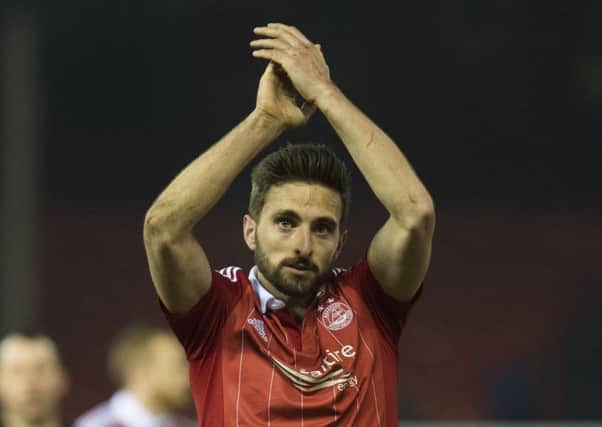 Graeme Shinnie has signed a contract extension until 2019. Picture: SNS