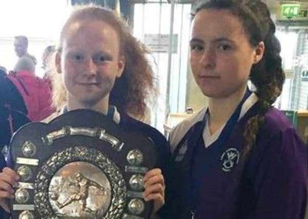 Georgia, holding the shield, and Mhairi Crooks will play in the Scottish Schools team.