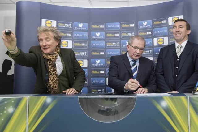 Sir Rod Stewart (left), along with SFA President Alan McRae (centre) and Alan Stubbs during the William Hill Scottish Cup fifth round draw. Picture: PA