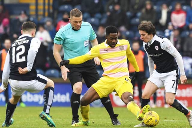 Hearts debutant Lennard Sowah is challenged by Raith Rovers Ross Matthews and Chris Johnston. Picture: SNS.
