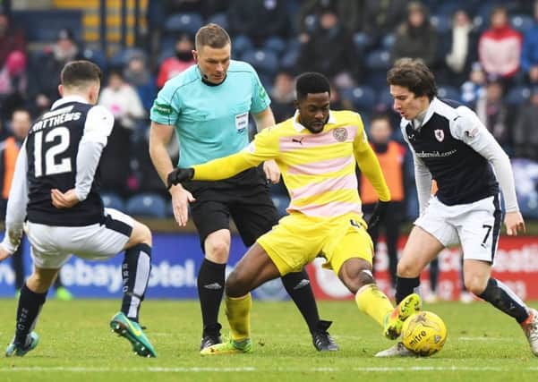 Hearts debutant Lennard Sowah is challenged by Raith Rovers Ross Matthews and Chris Johnston. Picture: SNS.