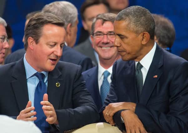 Former Prime Minister David Cameron and US President Barack Obama. Dominic Lipinski/PA Wire