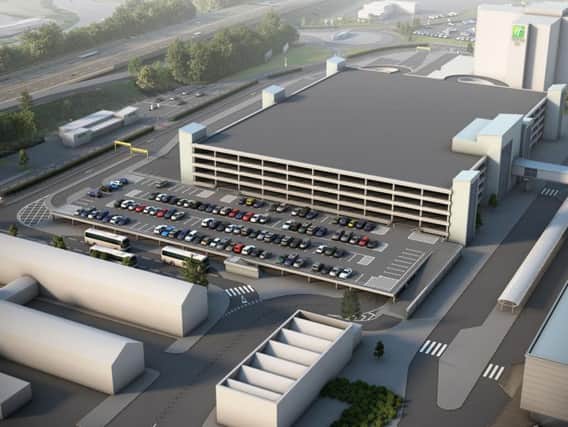 How the new drop-off and pick-up area beside the multi-storey car park will look when it is opened in April, with the terminal on the right
