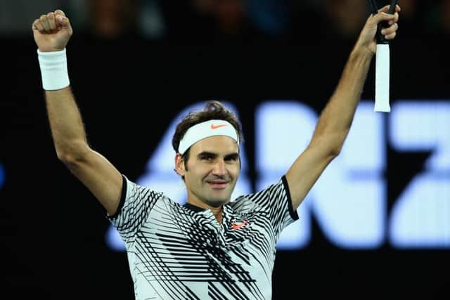 Roger Federer celebrates winning match point in his quarter-final against Mischa Zverev of Germany. Picture: Clive Brunskill/Getty Images