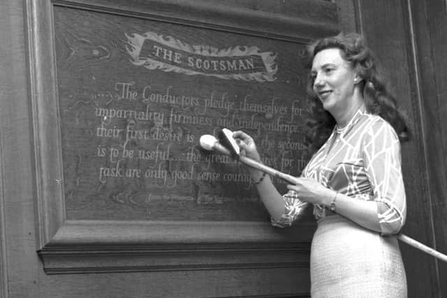 The gold leaf plaque bearing the pledge from The Scotsmans Prospectus is refurbished at North Bridge, 1965. Picture: TSPL