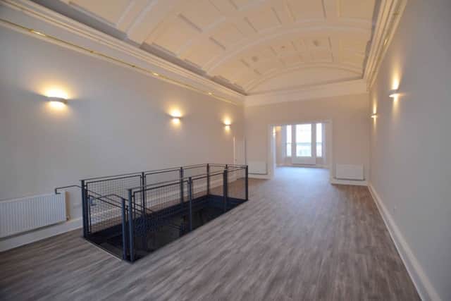 The vaulted former ballroom in the first floor unit.