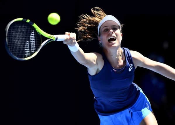 Johanna Konta makes a forehand return to Serena Williams during the Australian Open quarter-final. Picture: Andy Brownbill/AP