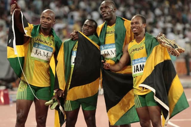 Jamaica's gold medal winning relay team, Usain Bolt. (AP Photo/Itsuo Inouye, File)