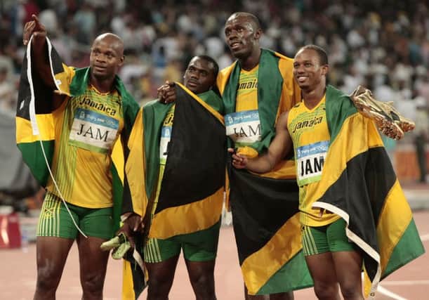 Jamaica's gold medal winning relay team, Usain Bolt. (AP Photo/Itsuo Inouye, File)