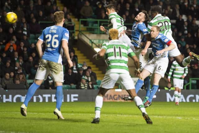 Celtic defender Dedryck Boyata, right, heads home what proved to be the winner against St Johnstone at Celtic Park. Picture: Craig Foy/SNS