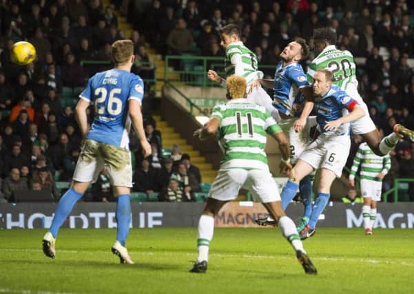 Celtic defender Dedryck Boyata, right, heads home what proved to be the winner against St Johnstone at Celtic Park. Picture: Craig Foy/SNS