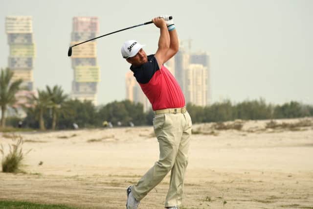 Northern Ireland's Graeme McDowell plays his second shot on the ninth hole during the first round of the Commercial Bank Qatar Masters. Picture: Ross Kinnaird/Getty Images