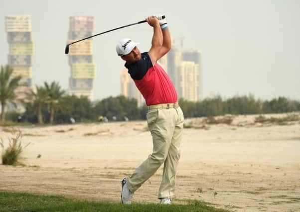Northern Ireland's Graeme McDowell plays his second shot on the ninth hole during the first round of the Commercial Bank Qatar Masters. Picture: Ross Kinnaird/Getty Images